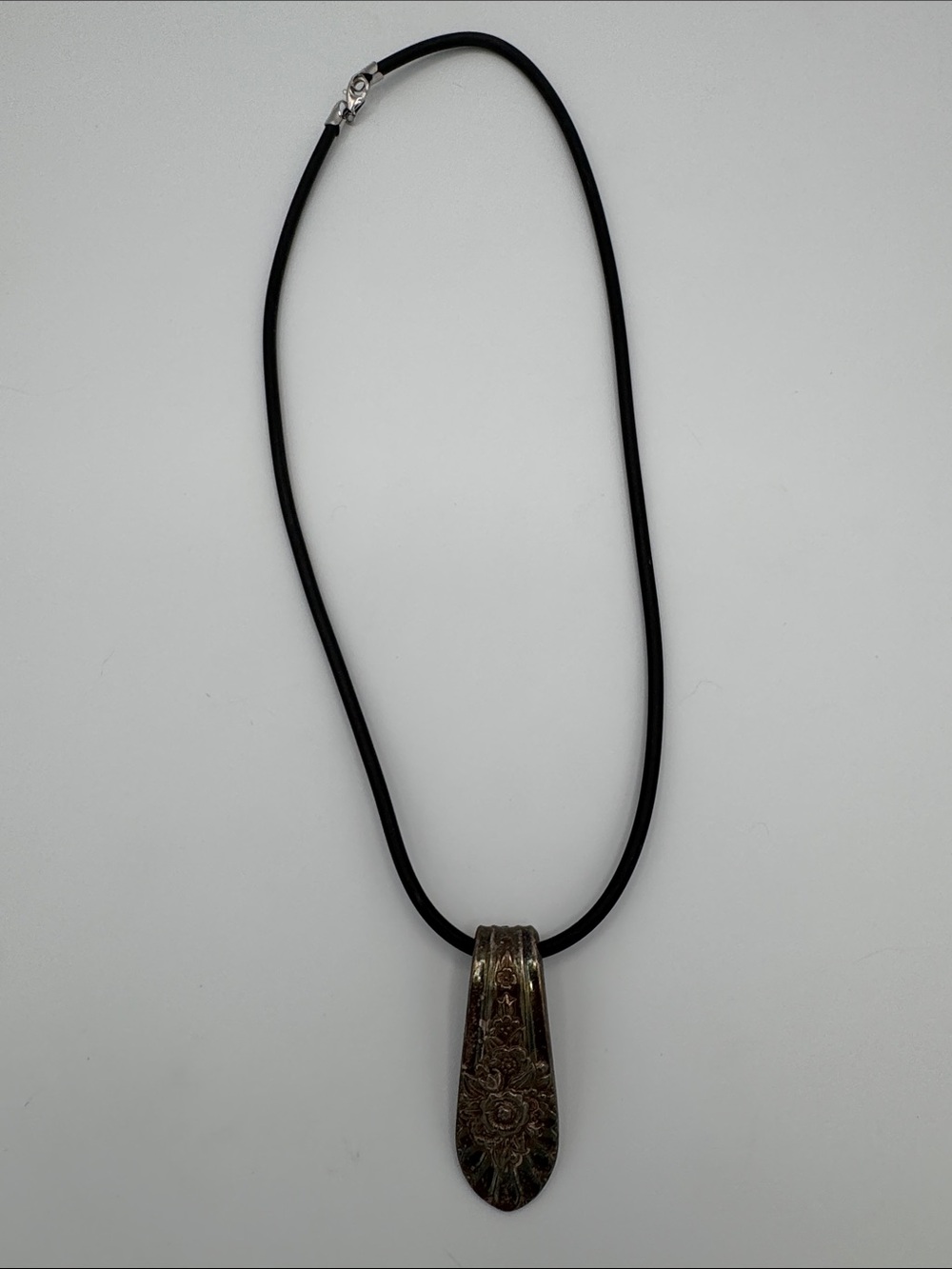 Black Cord Necklace with Ornate Floral Metal Pendant